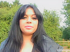 Fat brunette is kneeling in front of two guys in the forest