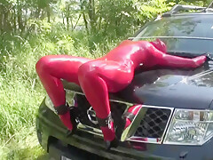 Girl Full Encased In Red Latex With Rubber Mask And Gloves Fucked On Car